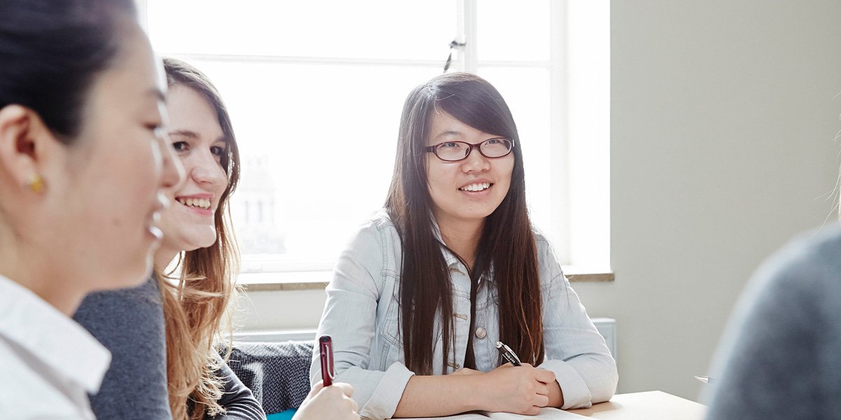 Three students at a desk