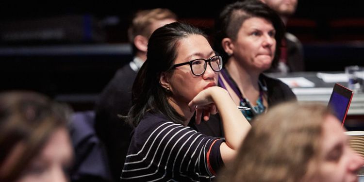 Group of people in an audience at a talk