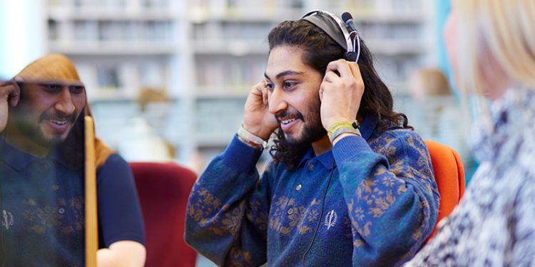 Student using headphones.