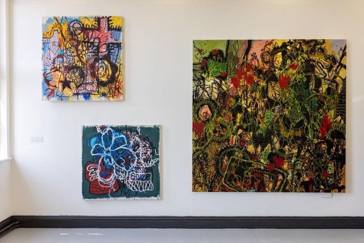 Three paintings by Tianna McIntosh displayed at the final year degree show