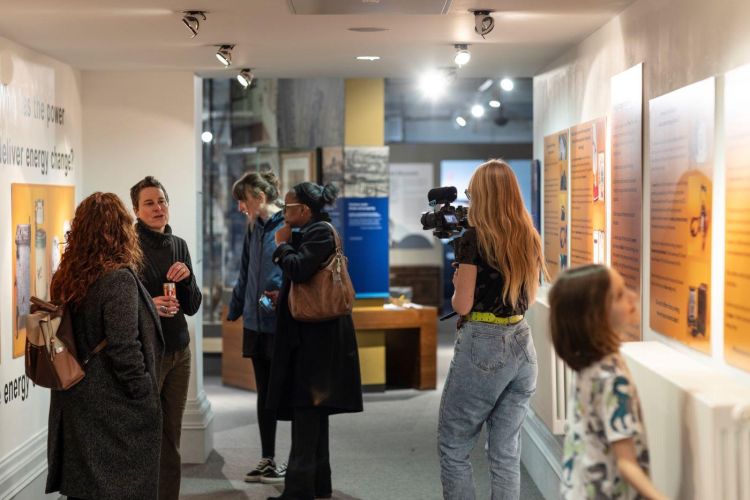 Visitors explore Whose Power? exhibition