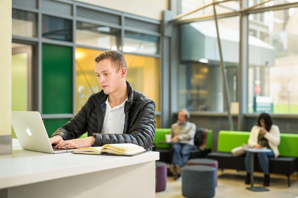 Student using laptop.