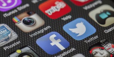Social media app icons on smartphone