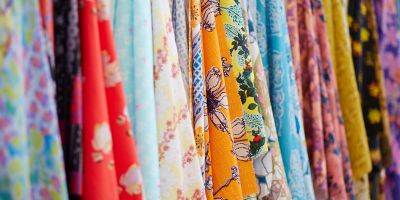 Pieces of textiles hanging in columns