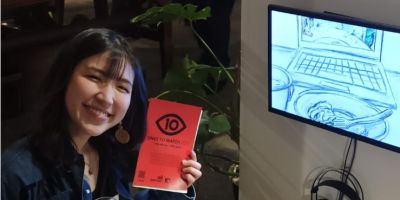 Artist Alice Chen posing with her exhibition at the Sunny Bank Mills Art Gallery