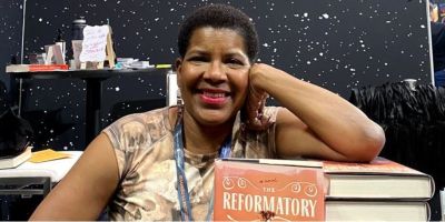 Tananarive Due with copies of her new book 'the Reformatory'.