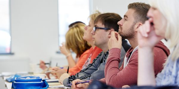 Group of people in an audience at a talk