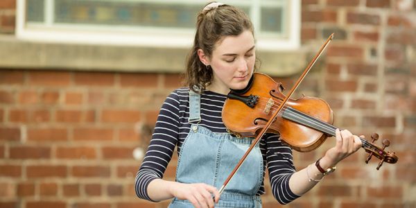 Student playing violin