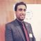 Aiman Al Owaisi looking at camera