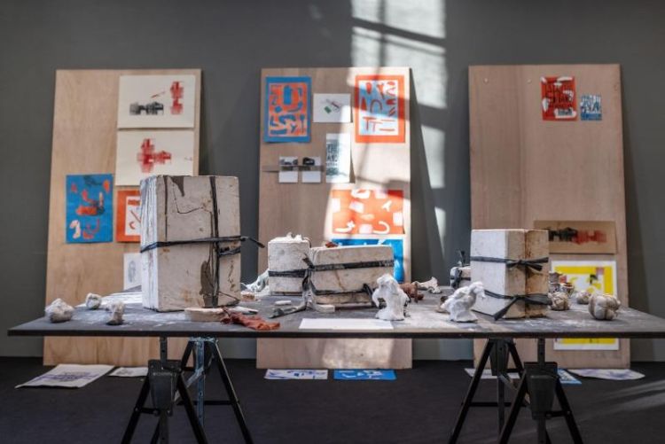 Project space in the School of Fine Art, History of Art and Cultural Studies capturing a variety of student work on display such as prints and sculptural pieces.