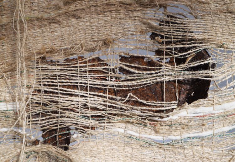 Close up view of artwork by Alice Boot, created with Hessian, ash tree, found metal, wood, cheese cloth.
